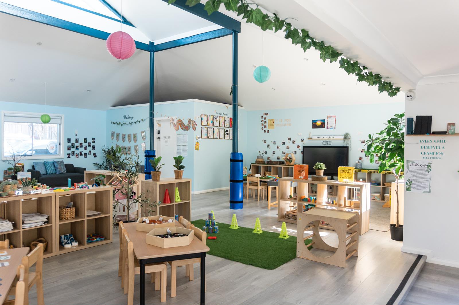 Infant play space with soft play structures and low shelves