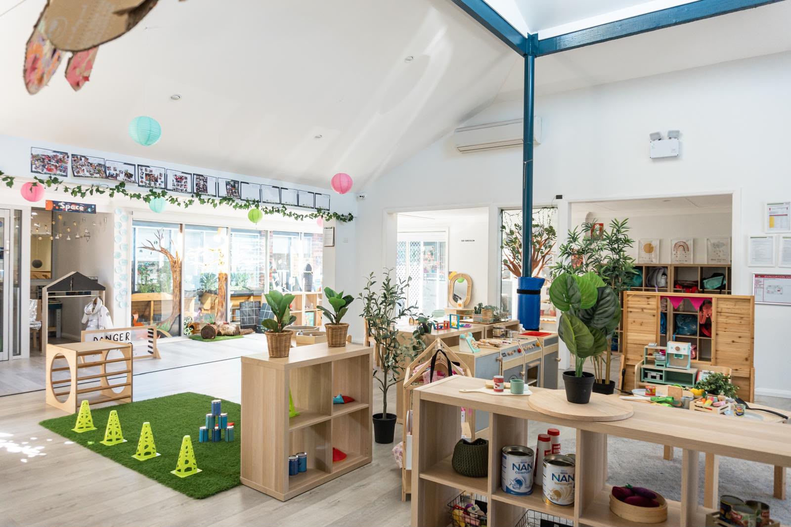 Indoor activity room with climbing frame and mats